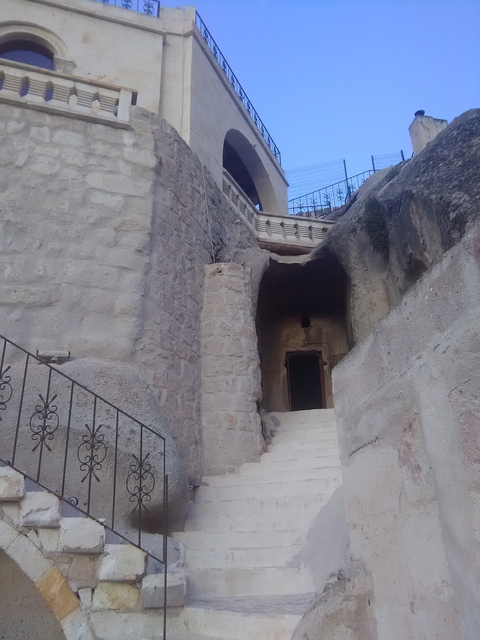 Stone entrance with stairs and archway