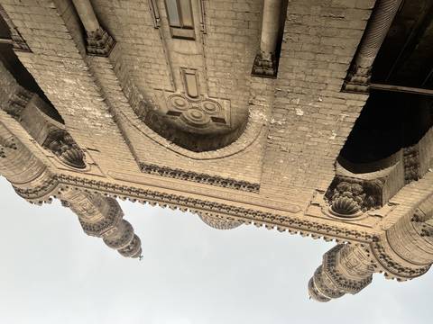       A historic stone building with intricate carvings.
  