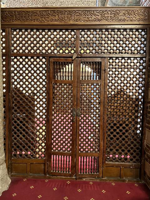 Decorative wooden latticework with intricate patterns.
