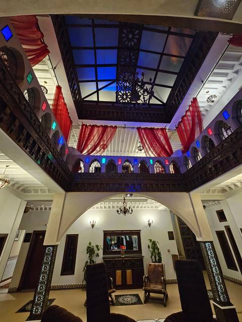 Interior of a building with colorful fabric and architecture.