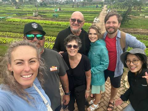 Group photo in a garden setting.
