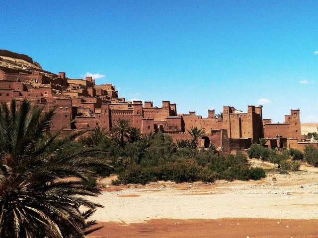       Ancient fortified city under a clear blue sky.
  