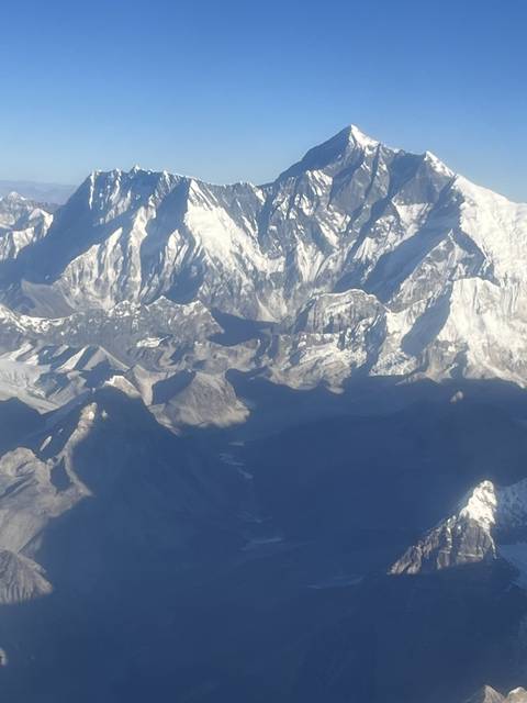       View of a snow-capped mountain range.
  