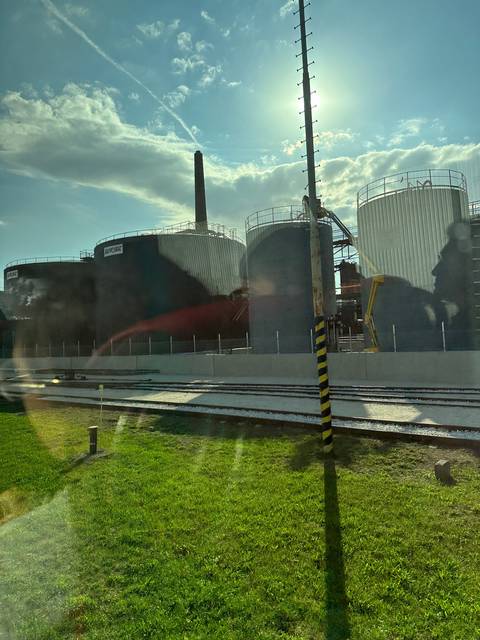 Storage tanks and industrial chimney.