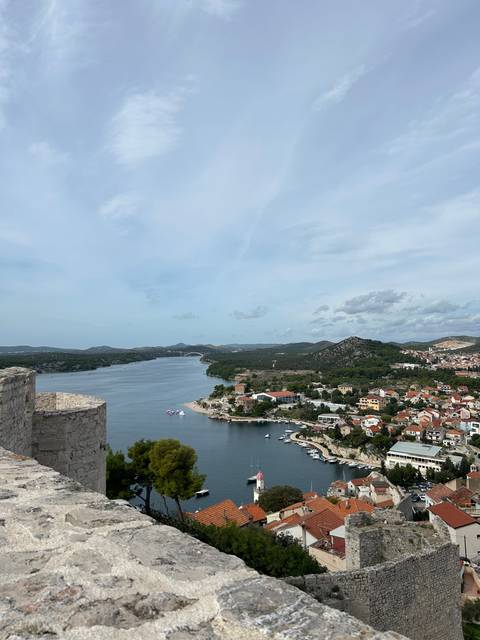       Coastal city view from a high vantage point.
  