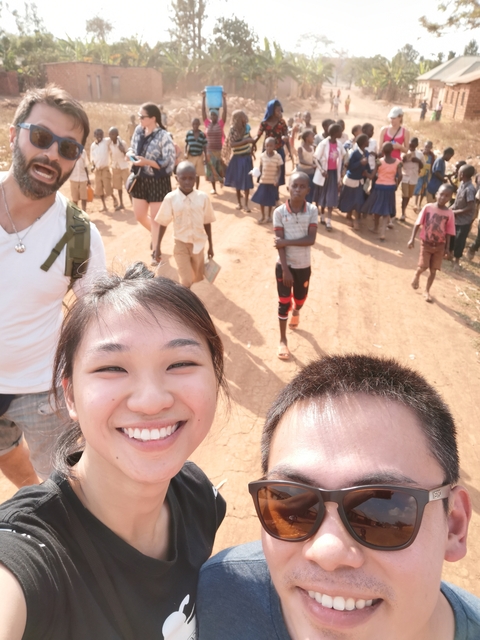       A person taking a selfie in a rural community setting.
  