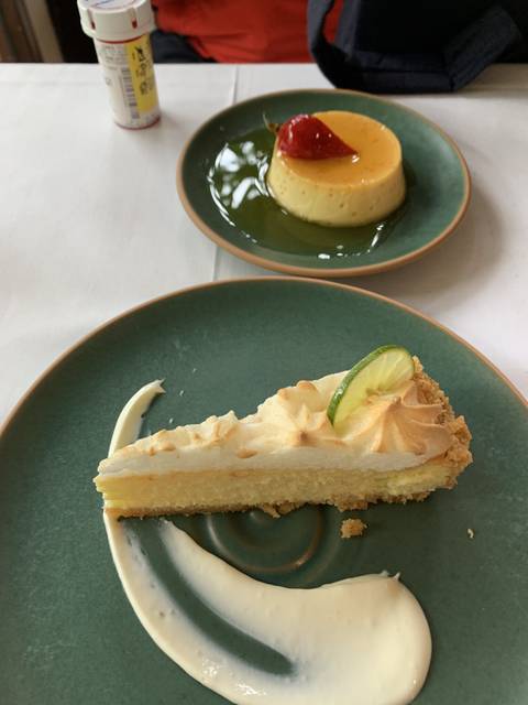 Two plates of dessert with a lime topping.