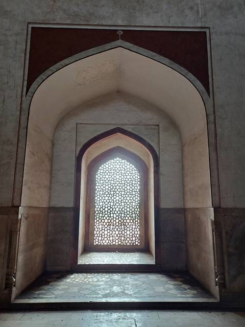 Ornate window with intricate latticework.