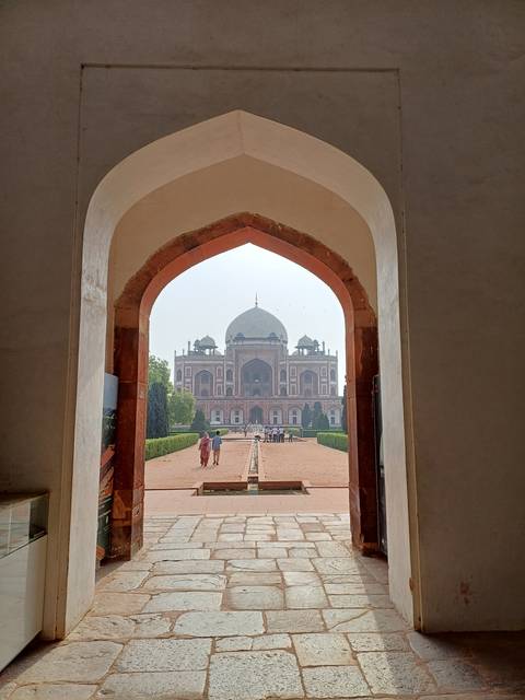 Historical site view through an archway.