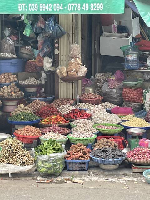 Various types of produce displayed at a market.