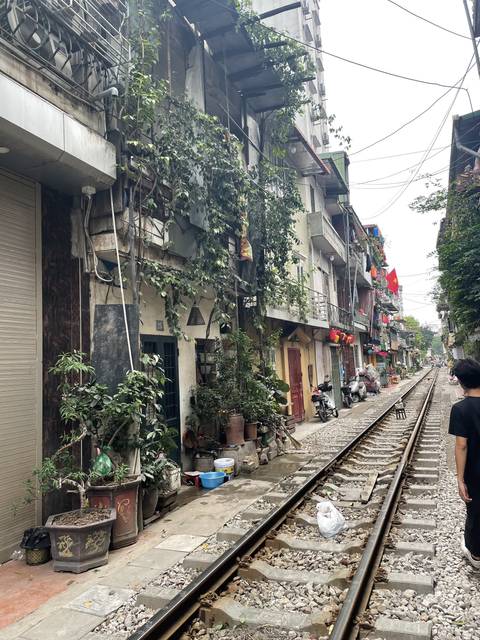 Urban area with rail tracks and buildings.