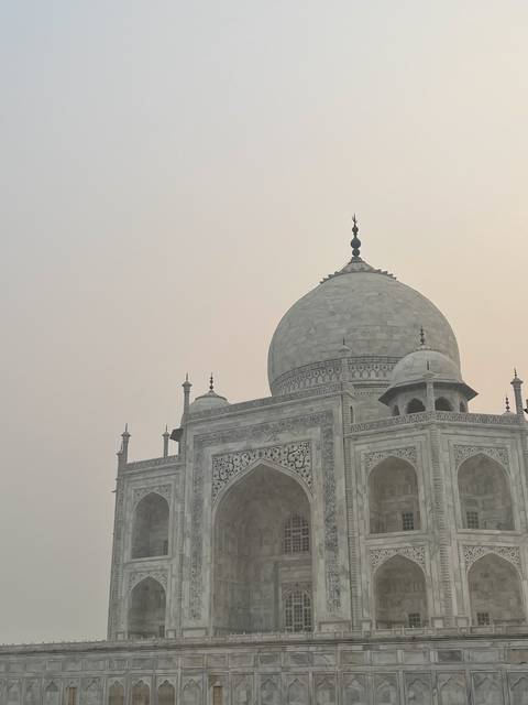       The Taj Mahal with its intricate designs and dome.
  