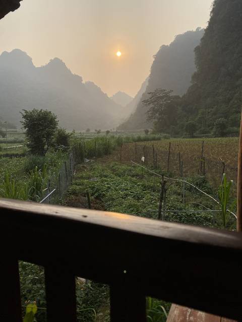       Sunrise view over a misty mountain landscape.
  