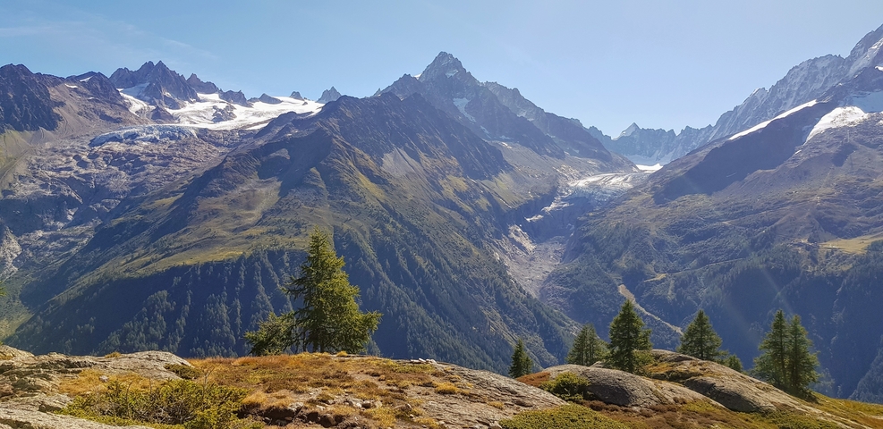Spectacular view of snow-capped mountains and a valley.