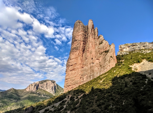 A striking rock formation against a blue sky.