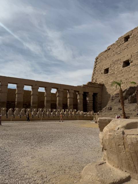 Ancient Egyptian temple ruins with statues