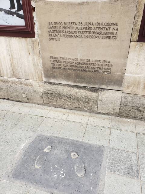 Plaque marking a historic event with engraved text.
