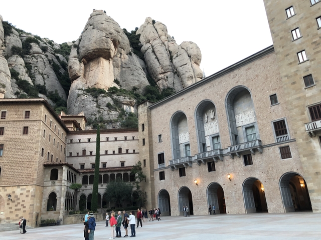       Monastery built into a rocky cliff.
  