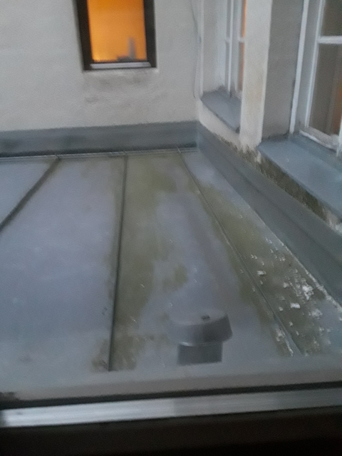 Blurred view of a rooftop.