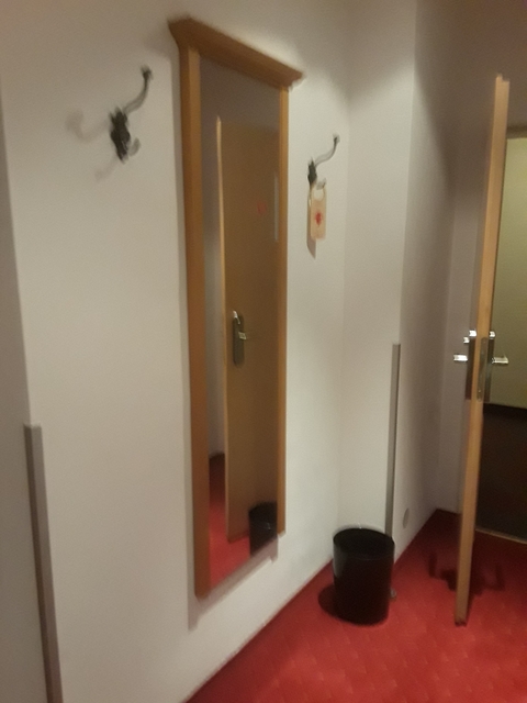Blurred view of an open hotel room door.