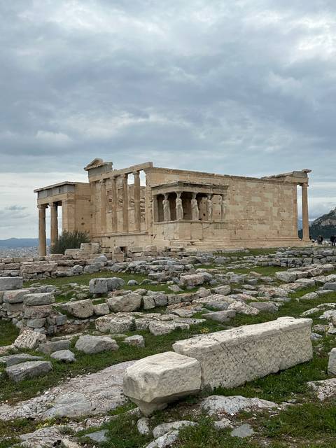 Ancient ruins with a cloudy sky above.