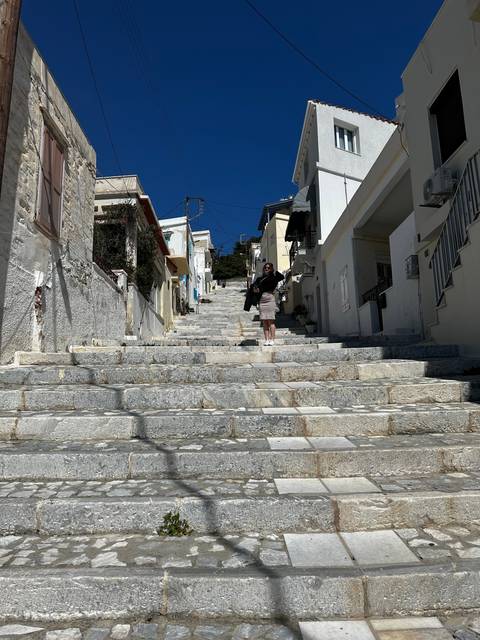 Stone staircase with a person walking upwards.