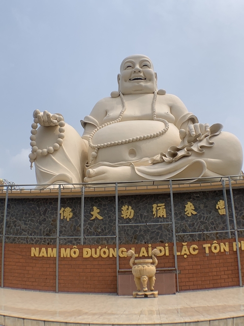 Large Buddha statue with inscriptions.