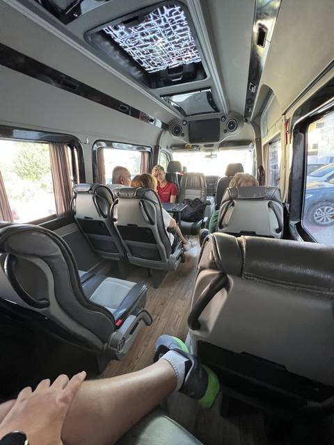       Interior of a van with passengers.
  