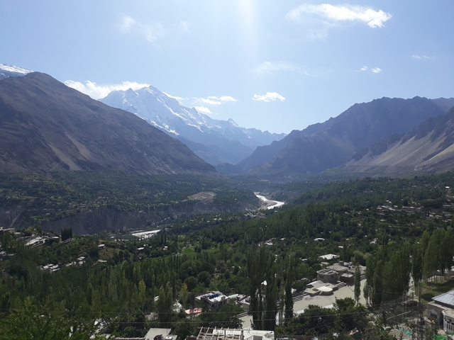       A beautiful mountain valley with snow-capped peaks.
  