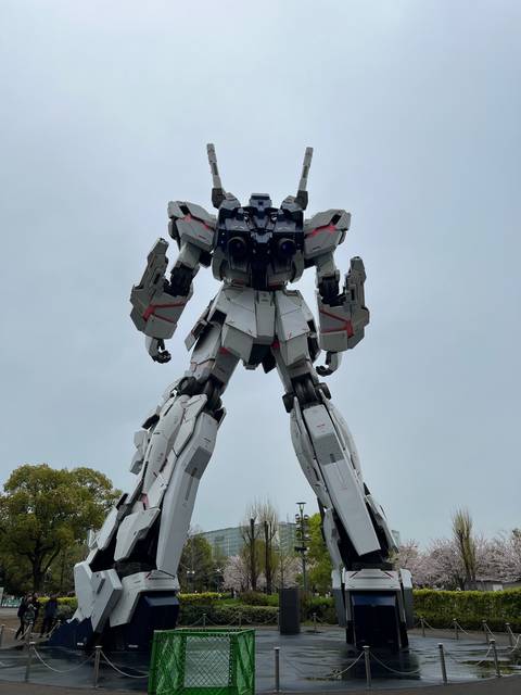       A large robot statue in an outdoor setting.
  