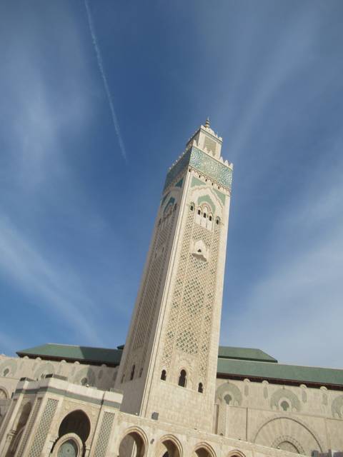       Detail of a tall mosque minaret.
  