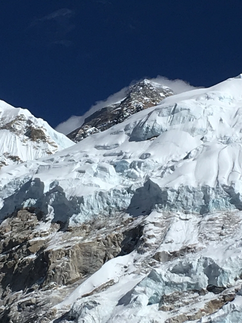       Close-up of a glacier and snow-covered peaks.
  