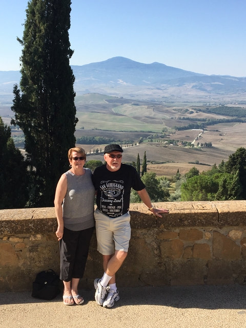       Couple posing at a scenic overlook.
  