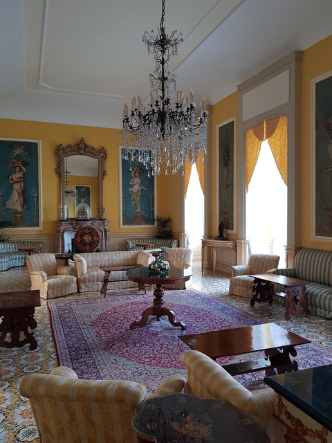       Luxurious interior of a historic building with ornate decor.
  