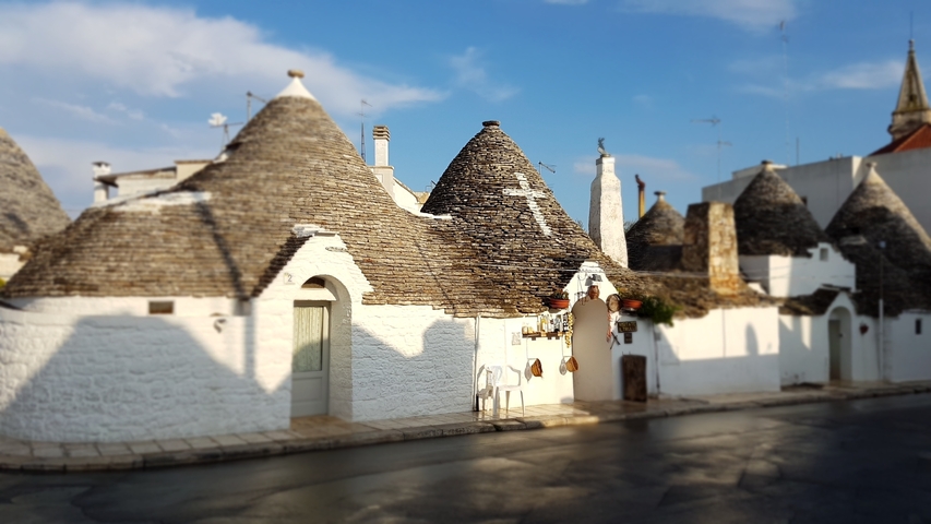 Trulli houses on a sunny day.