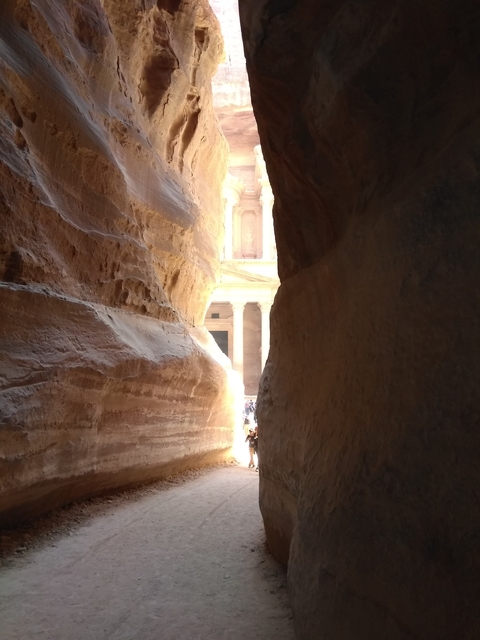       View of Petra's Treasury from a narrow canyon.
  