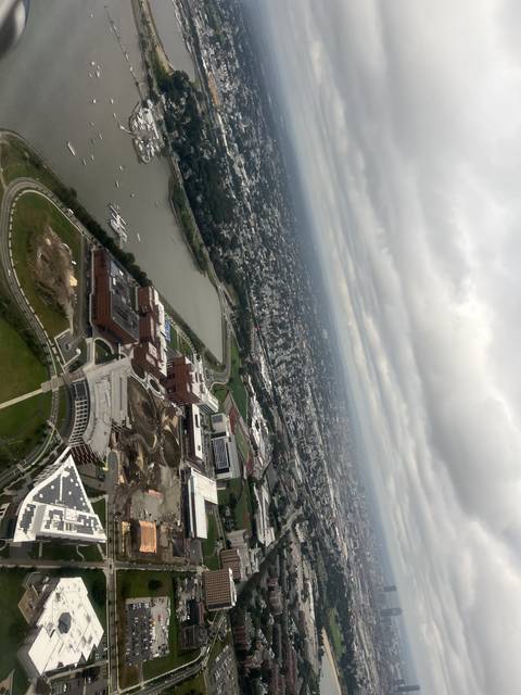 Skyline view of a city with water and buildings.