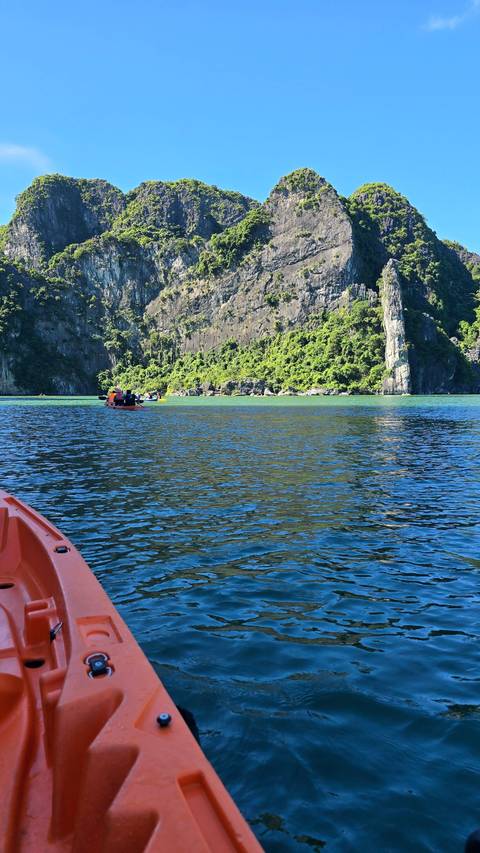       Kayak in the water with a view of limestone cliffs
  