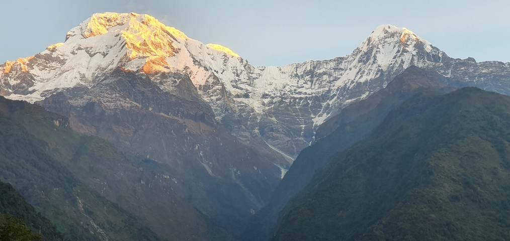 Majestic mountain range with snow at sunrise.