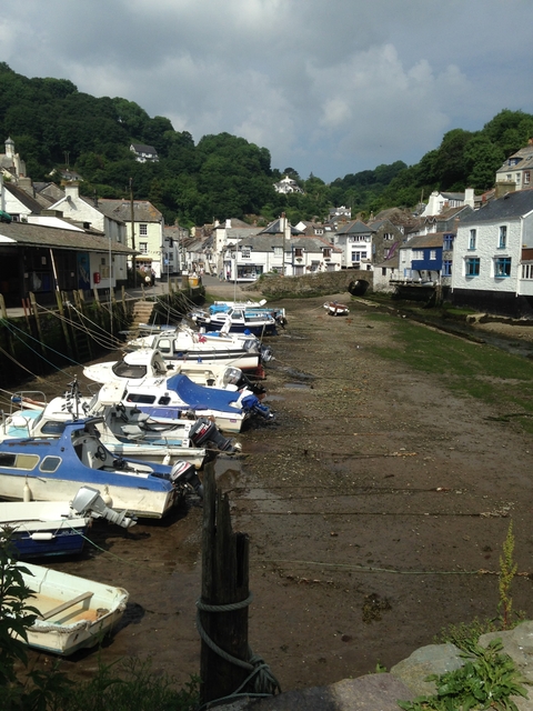 Harbor with boats, buildings in the background.