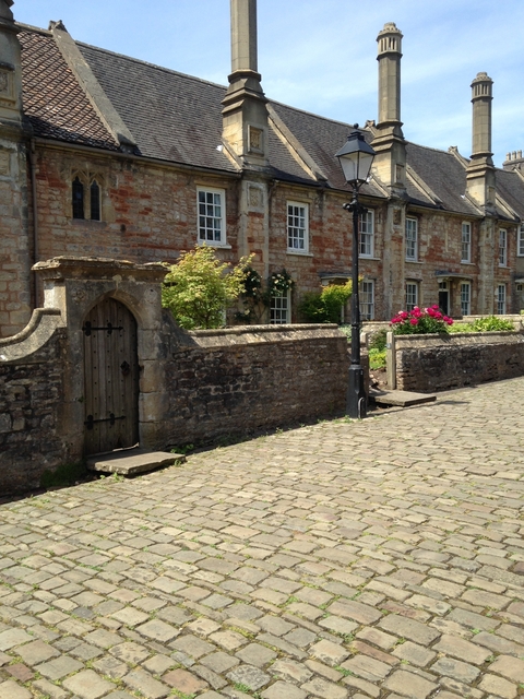       Old stone buildings with cobblestone street.
  