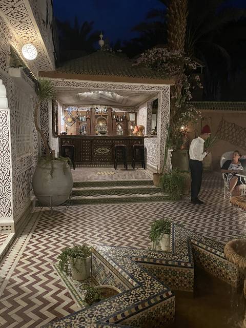 A traditional Moroccan courtyard with intricate tilework.