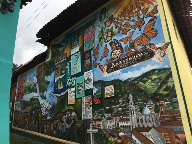       Colorful mural depicting butterflies and scenery
  