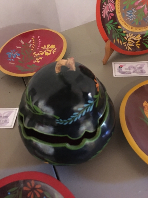       Display of colorful pottery items.
  