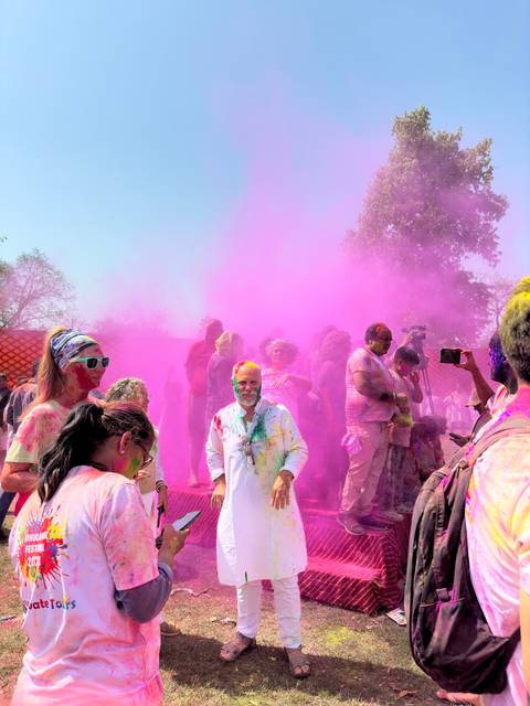       Group celebration of Holi with colorful powders.
  