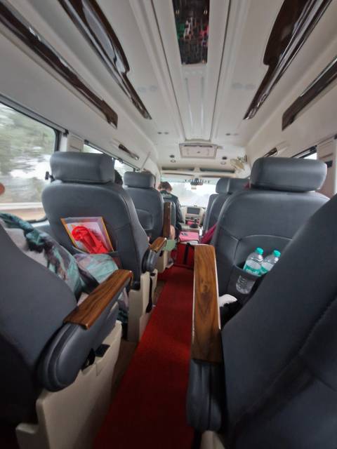       Interior of a vehicle with various seating arrangements.
  