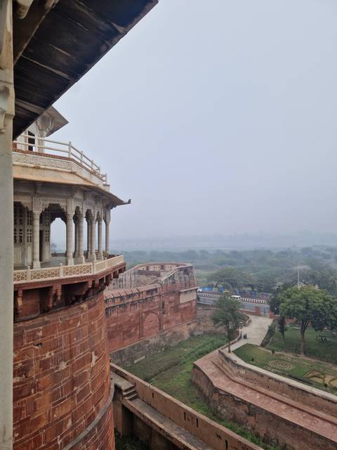       View of a historical fort and surrounding landscape.
  