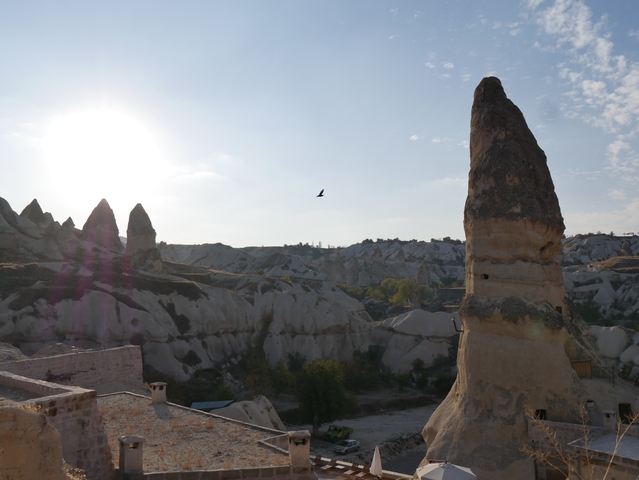       A unique rock formation under a clear sky, possibly in Cappadocia.
  