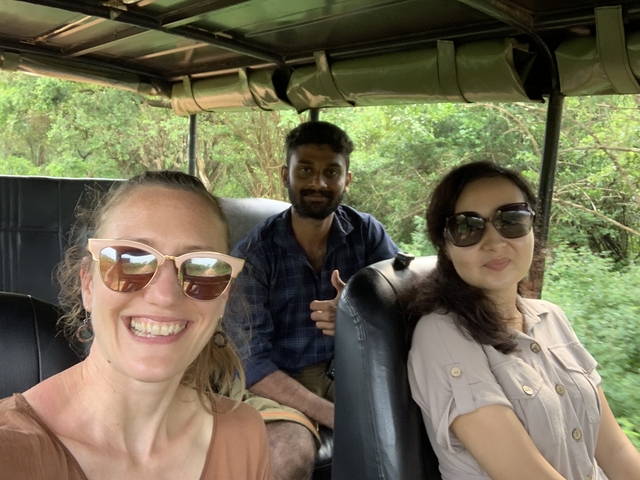 People inside a vehicle, enjoying a safari trip.