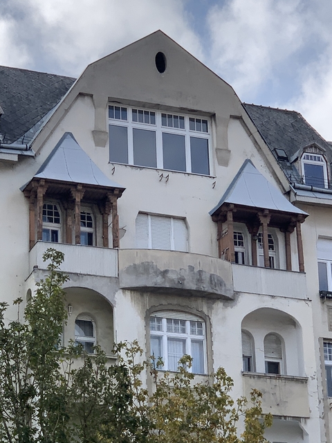 Close-up of a building facade with wooden features.